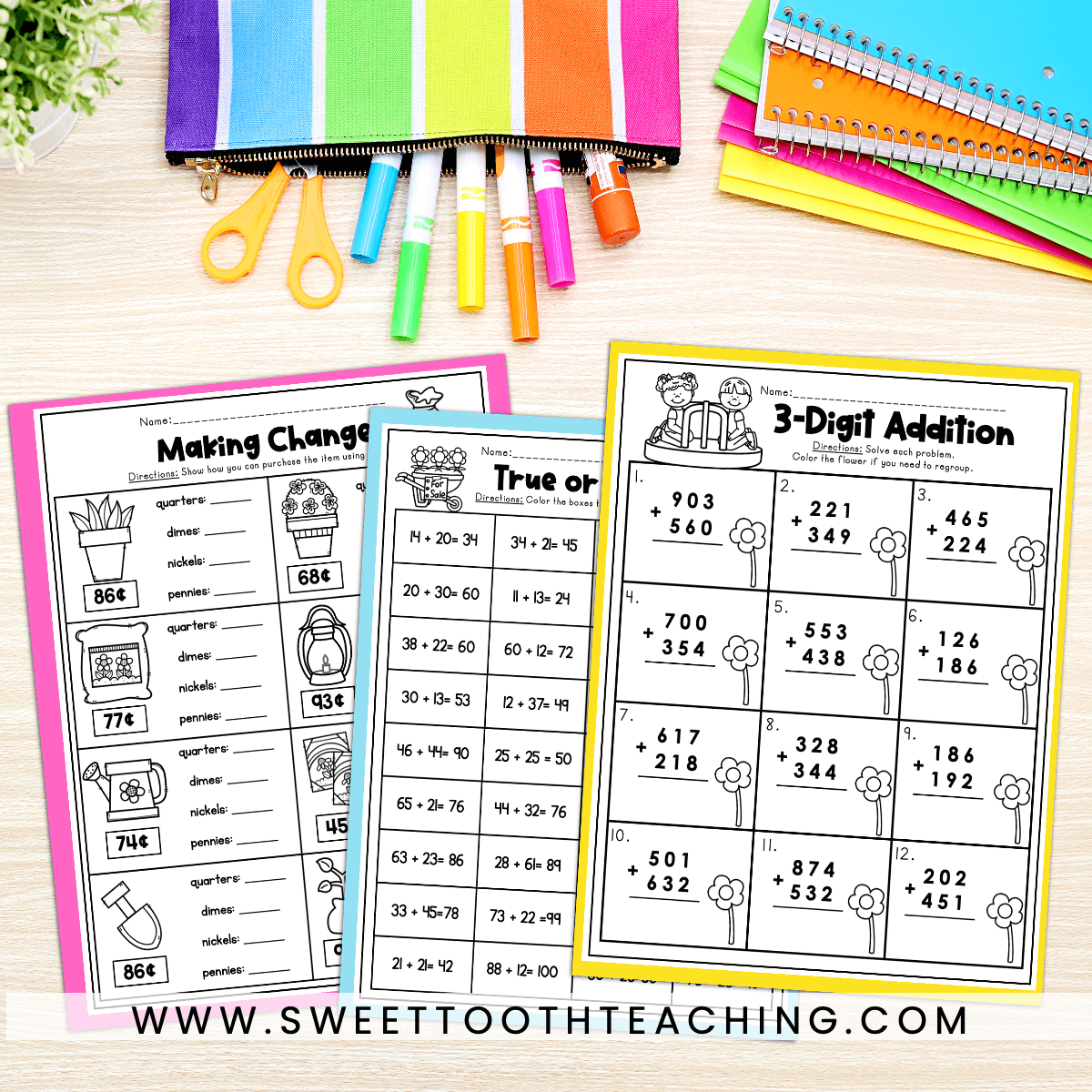 2nd grade math worksheets laying on a desk surrounded by colorful markers and notebooks