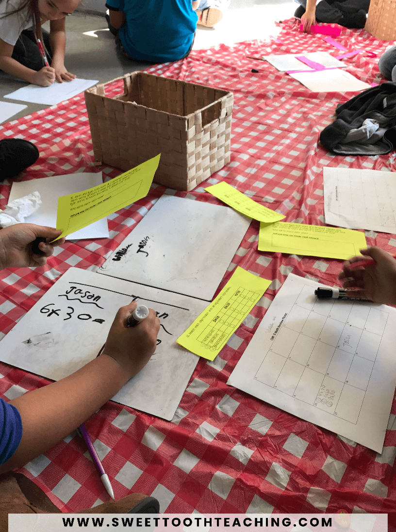 students use buckets to complete an activity outside